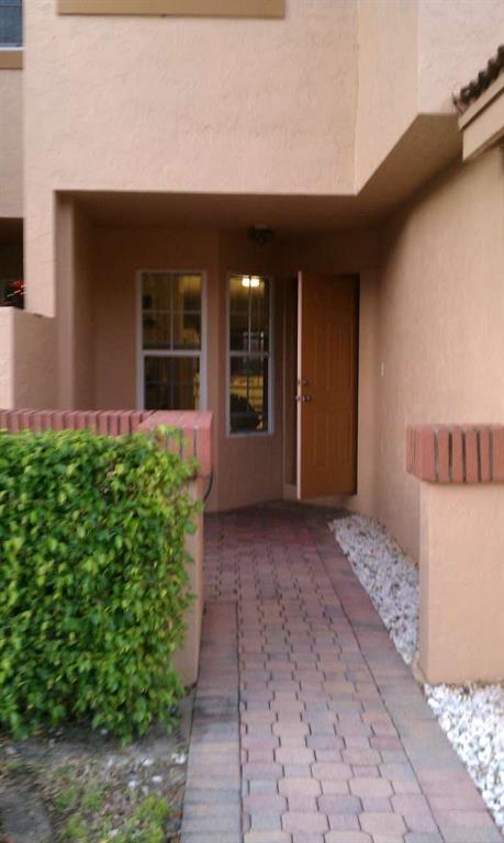 9395 Boca River Circle Boca Raton, FL 33434 - Photo 18 of 18 a view of a house with potted plants