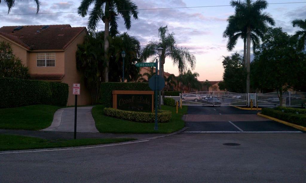 9395 Boca River Circle Boca Raton, FL 33434 - Photo 2 of 18 a swimming pool with outdoor seating and yard