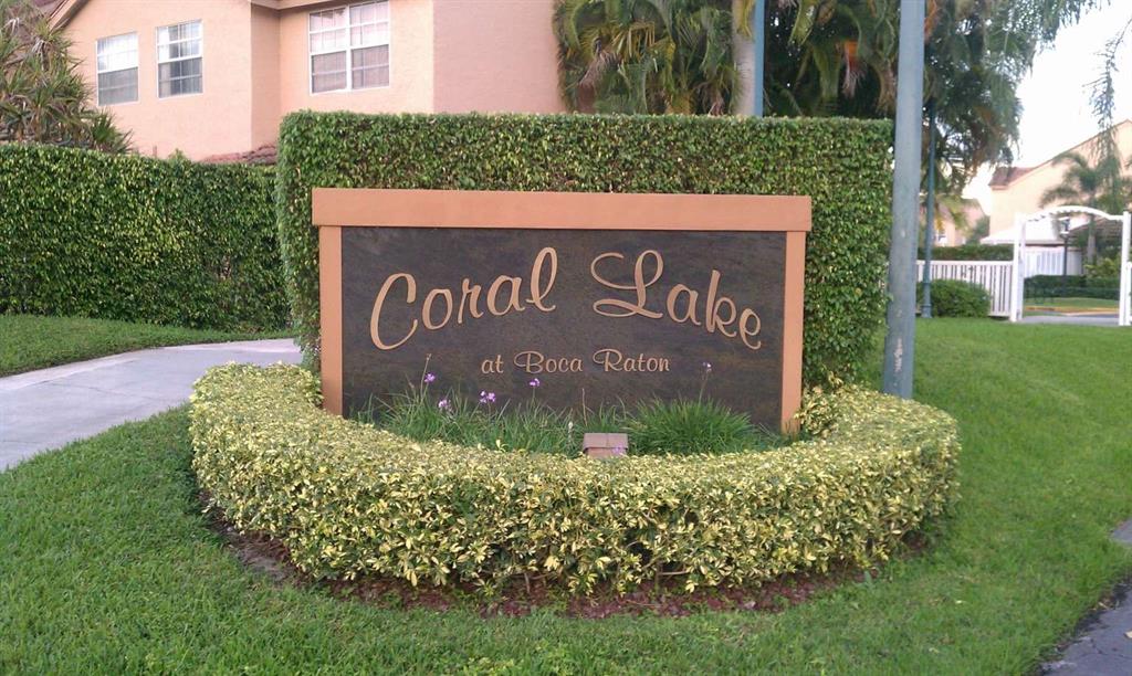 9395 Boca River Circle Boca Raton, FL 33434 - Photo 3 of 18 a sign that is sitting on the grass of the house