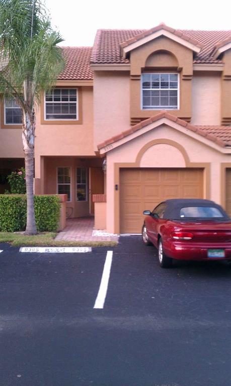 9395 Boca River Circle Boca Raton, FL 33434 - Photo 4 of 18 a front view of a house with parking space