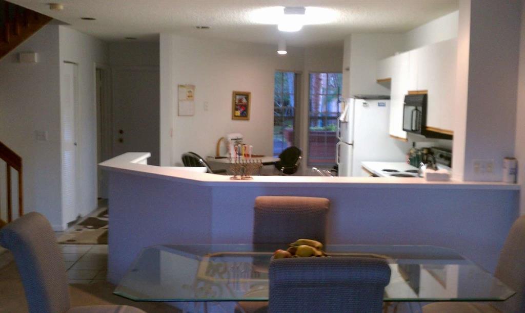 9395 Boca River Circle Boca Raton, FL 33434 - Photo 7 of 18 a room with furniture and view of kitchen