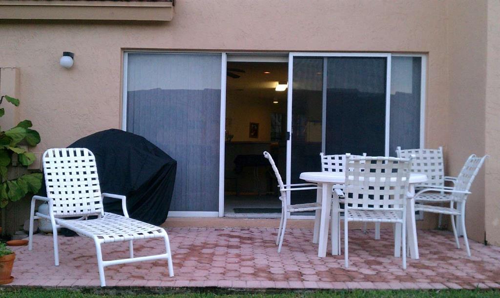 9395 Boca River Circle Boca Raton, FL 33434 - Photo 10 of 18 a view of a dining room with furniture
