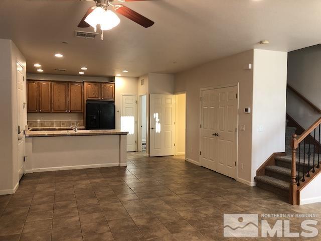 1775 Wind Ranch Road, Unit B Reno, NV 89521 - Photo 4 of 27 a view of kitchen with kitchen island microwave and stove