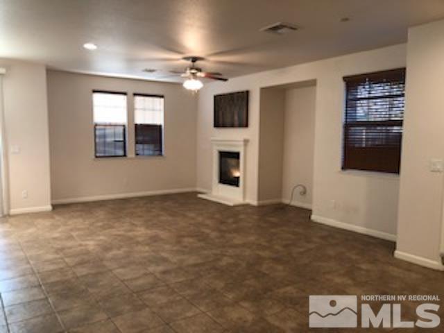 1775 Wind Ranch Road, Unit B Reno, NV 89521 - Photo 8 of 27 a view of an empty room with a window and fireplace