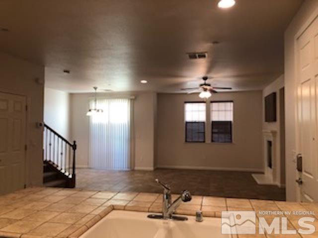 1775 Wind Ranch Road, Unit B Reno, NV 89521 - Photo 10 of 27 a bathroom with a sink and a mirror