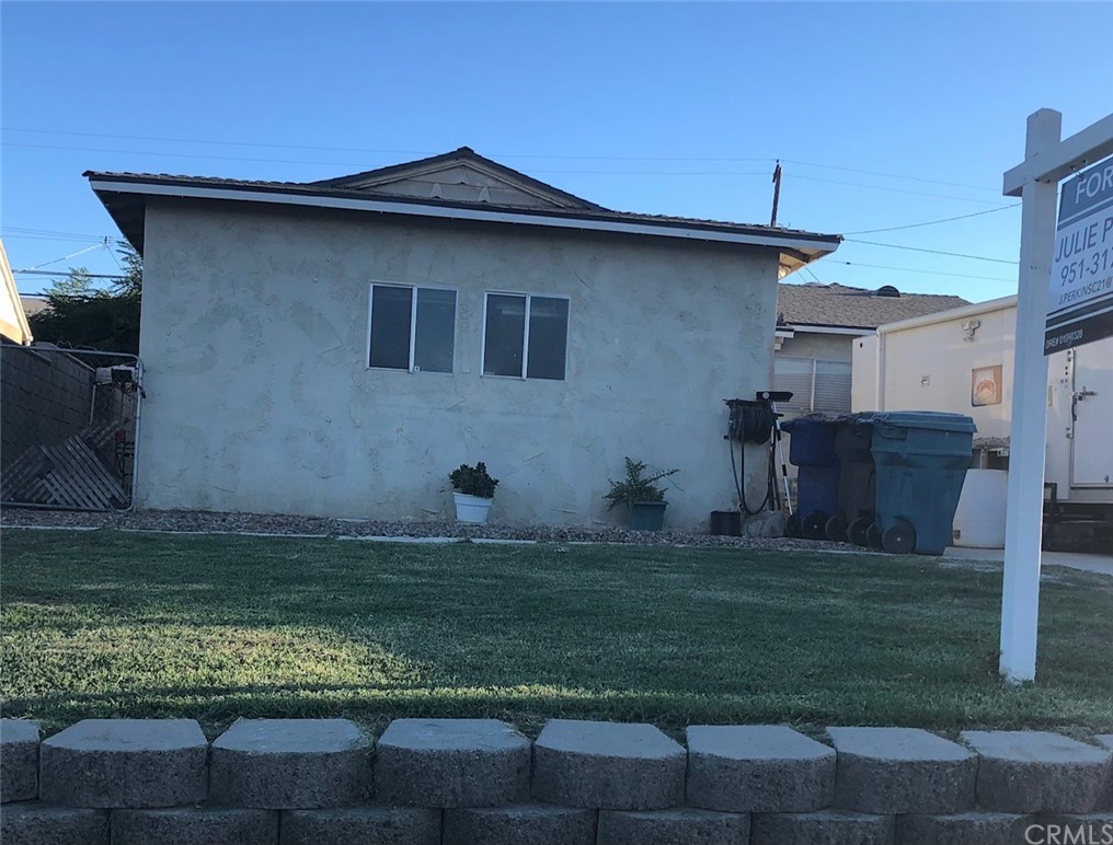 5010 Foothill Avenue Riverside, CA 92503 - Photo 1 of 1 a house with trees in the background