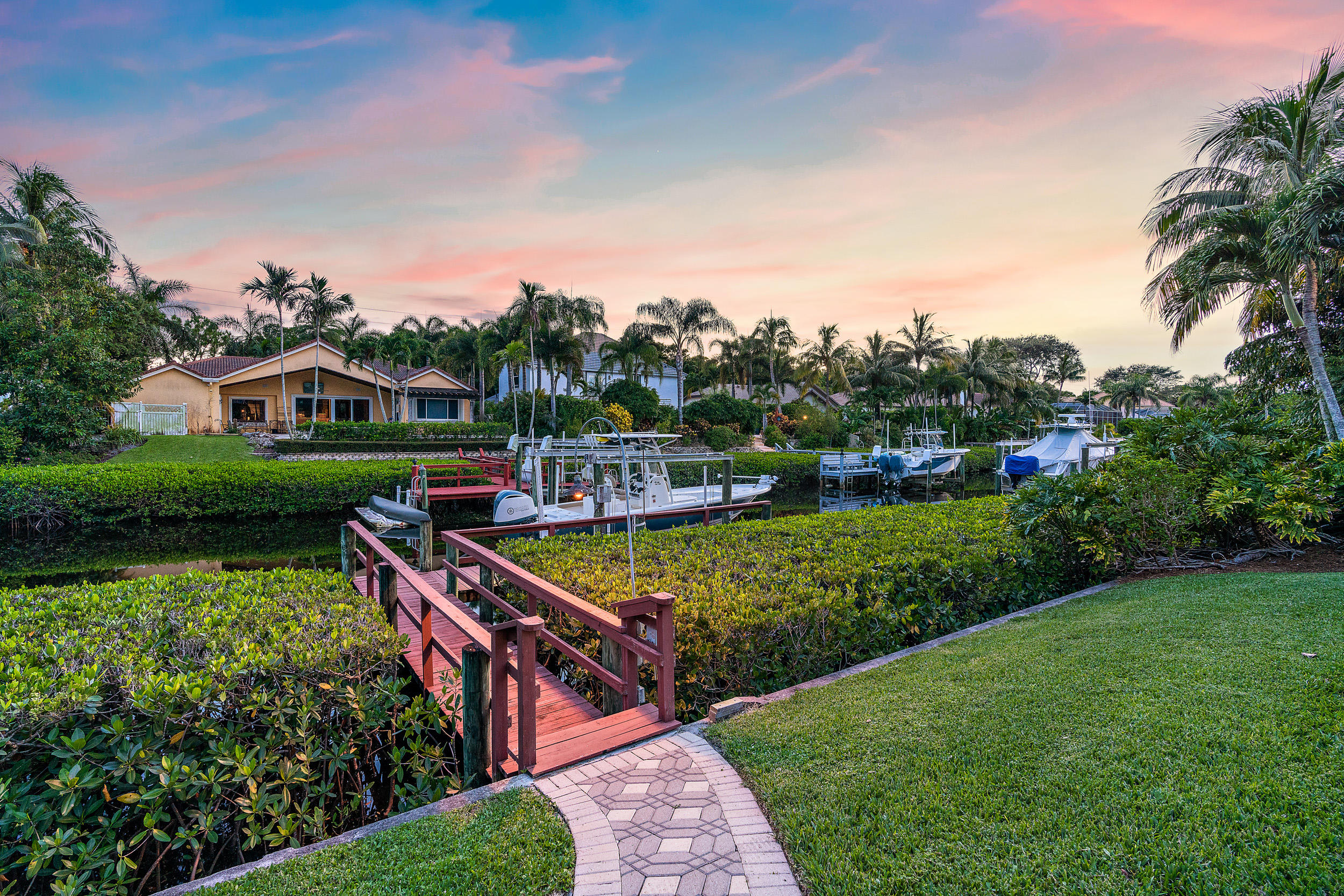 19866 Loxahatchee Pointe Drive Jupiter, FL 33458 - Photo 15 of 43 a picture of houses with outdoor space and trees