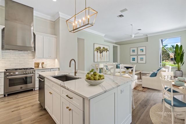 a kitchen with stainless steel appliances granite countertop a sink and cabinets