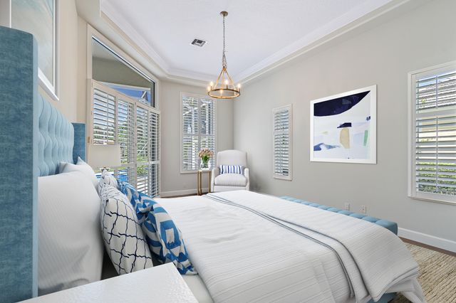 a bathroom with a granite countertop sink mirror and shower