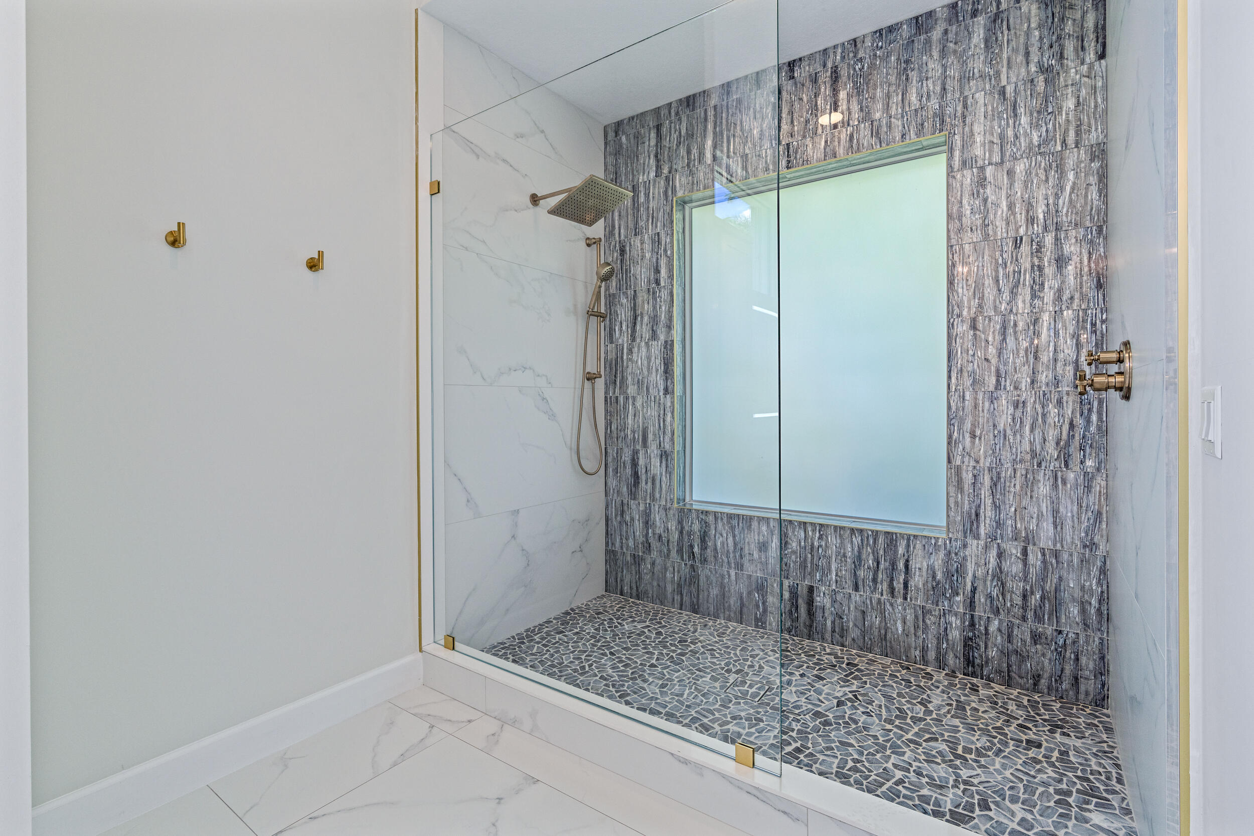 19866 Loxahatchee Pointe Drive Jupiter, FL 33458 - Photo 23 of 43 a bathroom with a shower