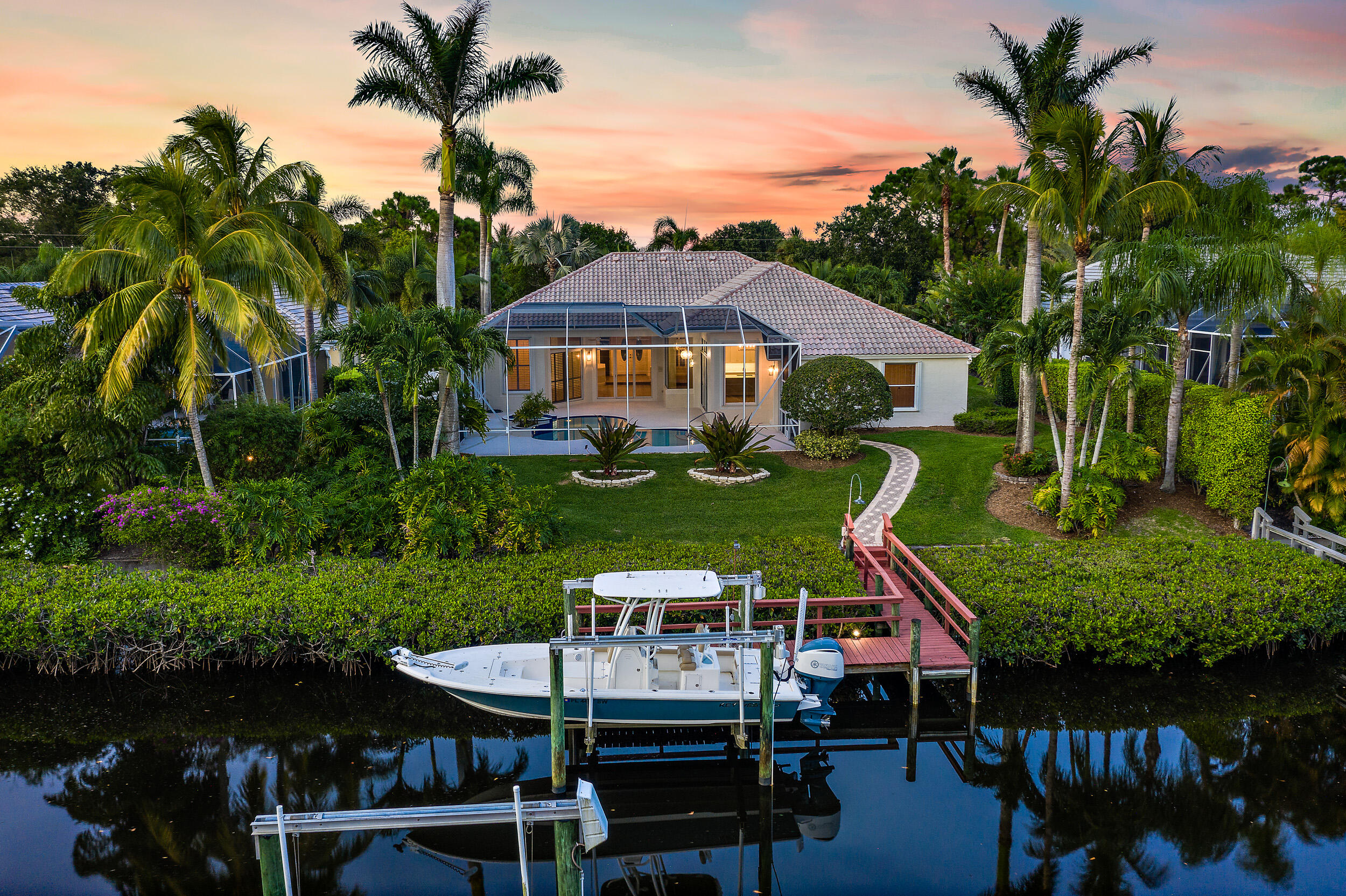 19866 Loxahatchee Pointe Drive Jupiter, FL 33458 - Photo 27 of 43 a view of a house with roof deck and yard