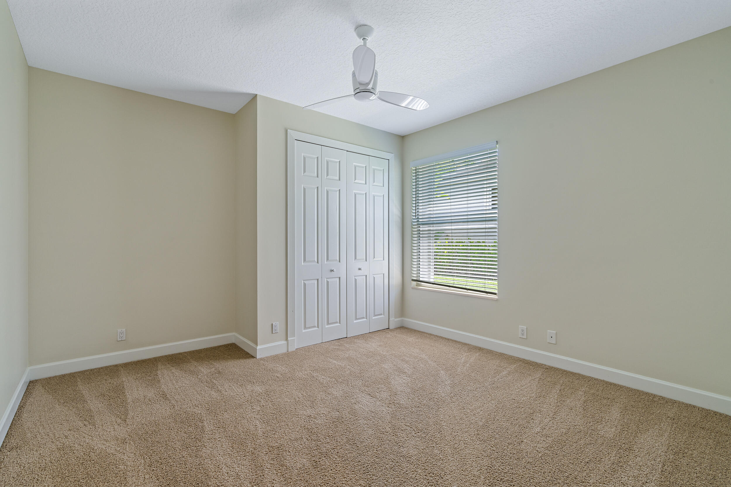 19866 Loxahatchee Pointe Drive Jupiter, FL 33458 - Photo 35 of 43 a view of an empty room with a window