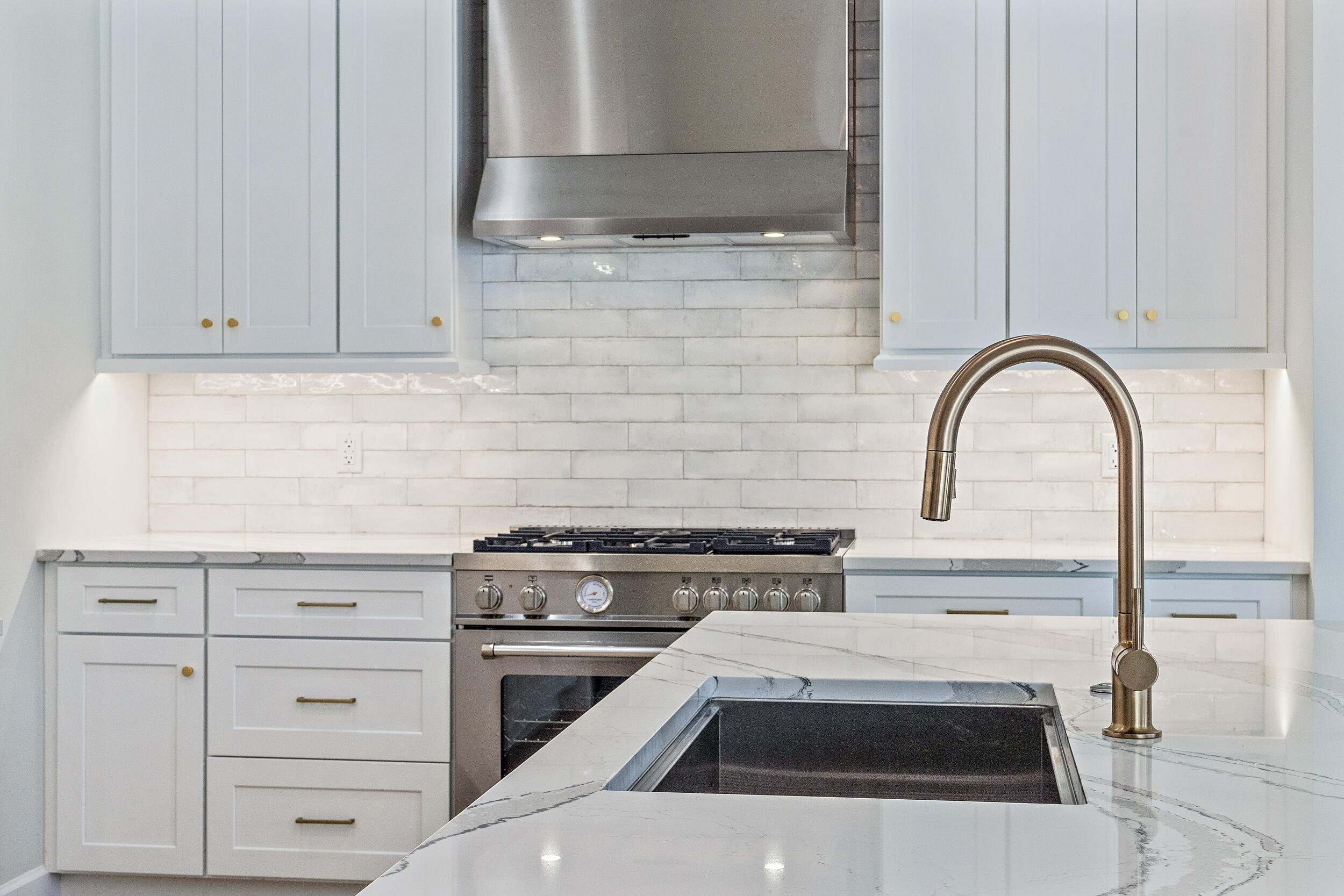 19866 Loxahatchee Pointe Drive Jupiter, FL 33458 - Photo 38 of 43 a white stove top oven sitting inside of a kitchen