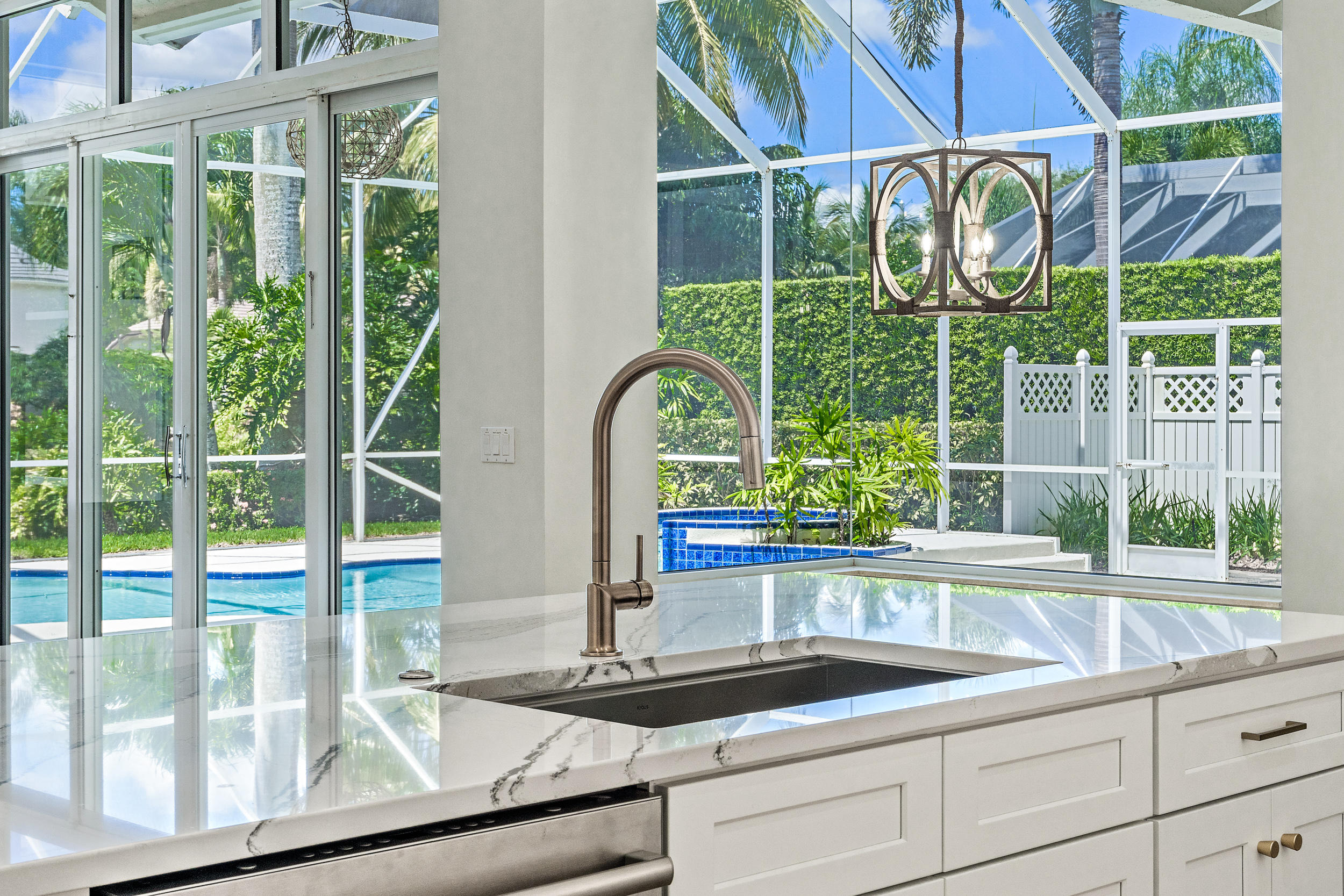 19866 Loxahatchee Pointe Drive Jupiter, FL 33458 - Photo 39 of 43 a kitchen view with a sink and glass window