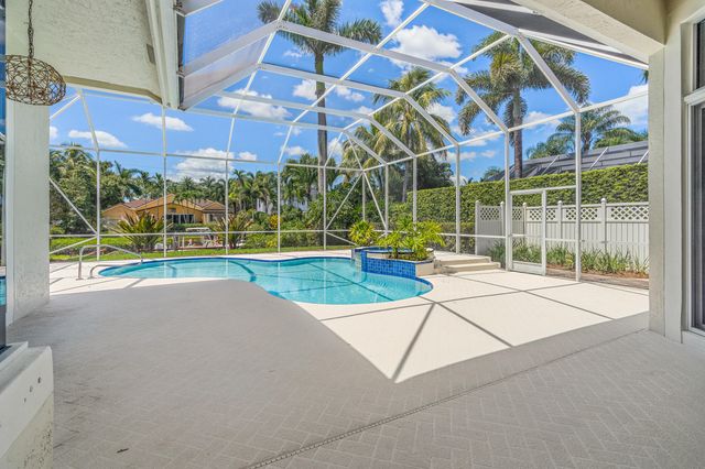 a view of a playground with a house
