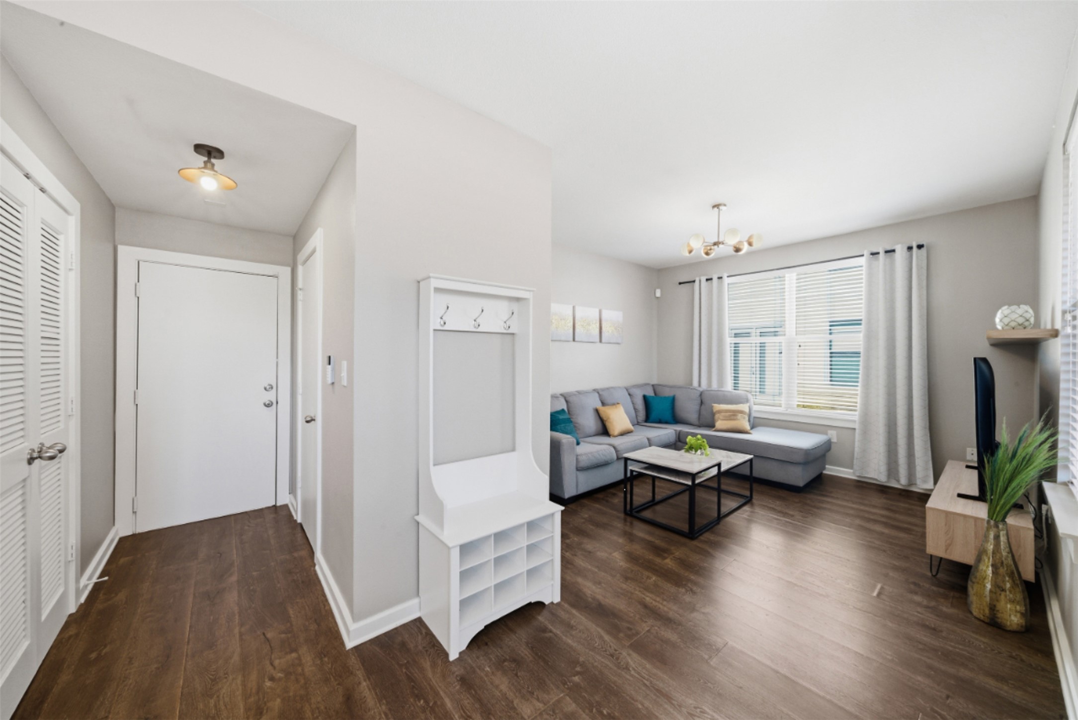 1201 Grove Boulevard, Unit 1304 Austin, TX 78741 - Photo 9 of 19 a living room with furniture and a wooden floor