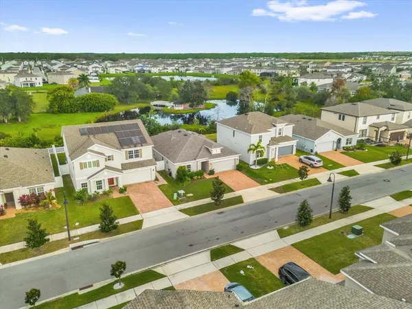 an aerial view of a house with a lake view