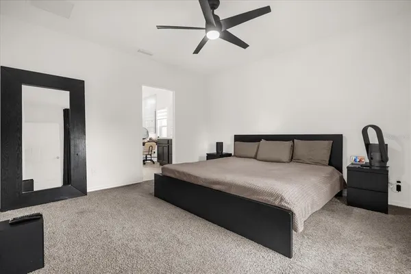 a bedroom with bed and window