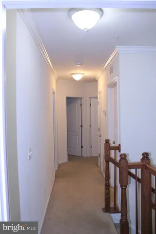 a view of a hallway with an empty room