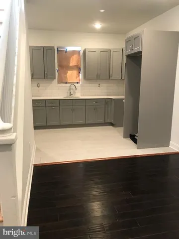 a view of kitchen with wooden floor