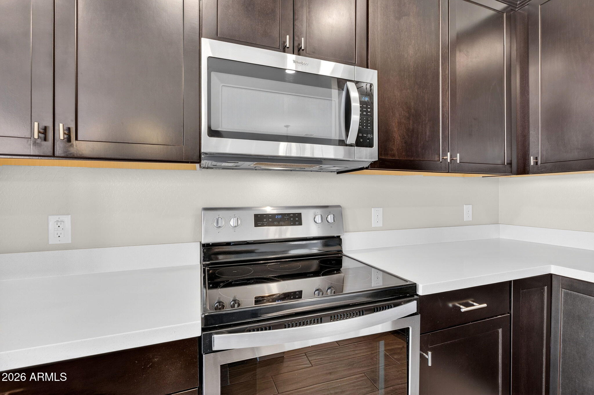 3900 East Baseline Road, Unit 149 Phoenix, AZ 85042 - Photo 13 of 54 a kitchen with a stove microwave and sink