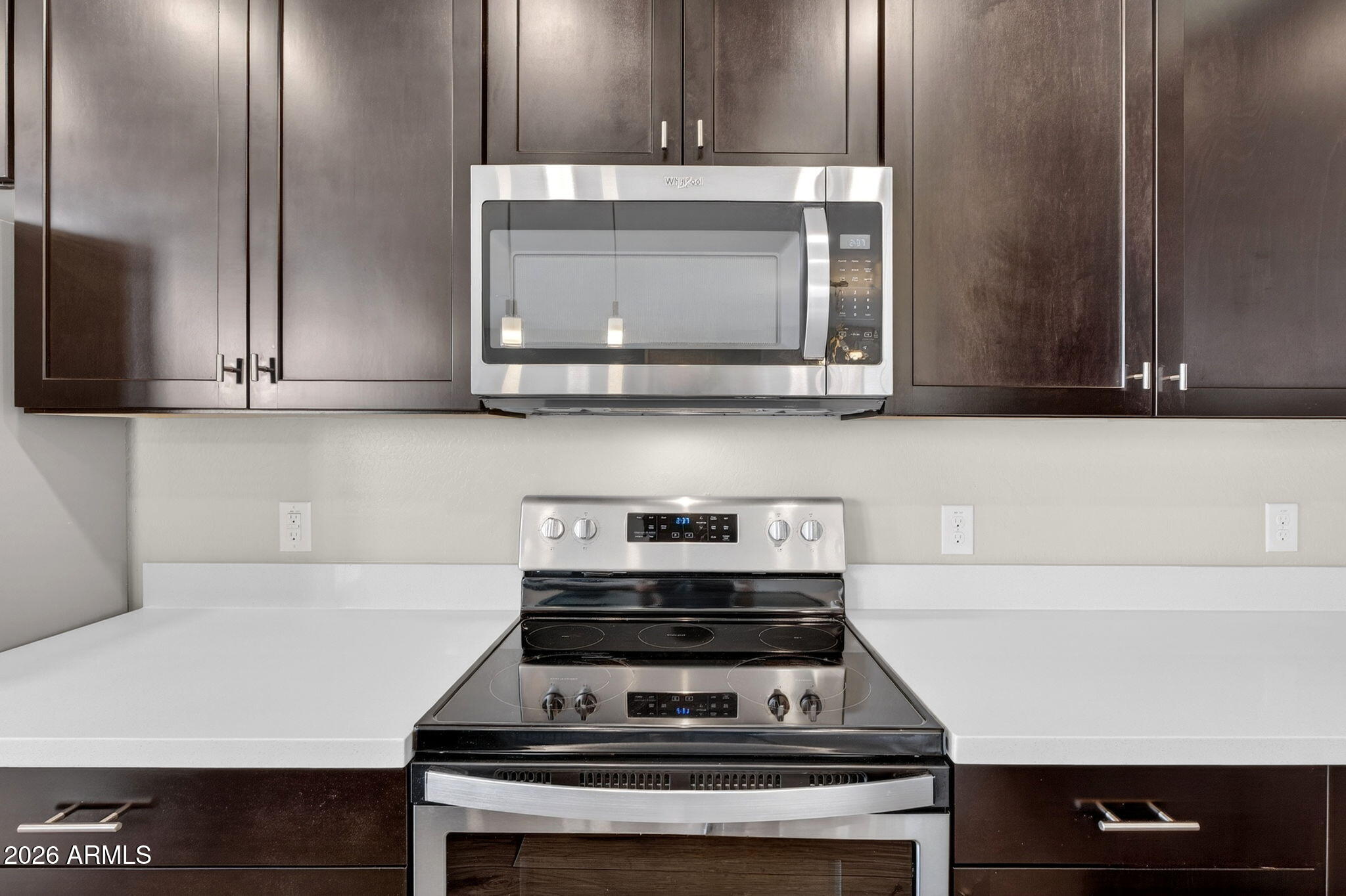 3900 East Baseline Road, Unit 149 Phoenix, AZ 85042 - Photo 14 of 54 a stove top oven sitting inside of a kitchen