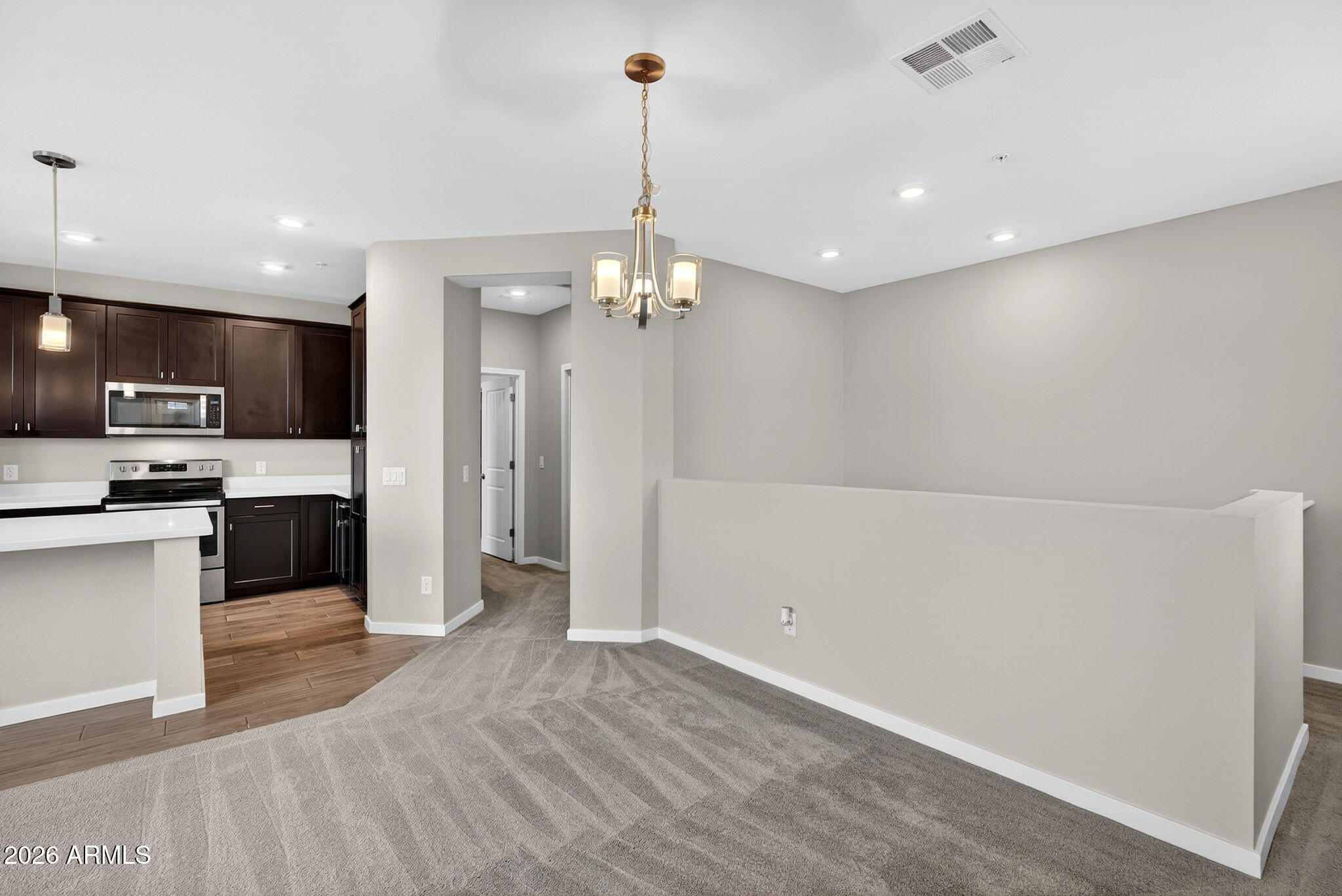 3900 East Baseline Road, Unit 149 Phoenix, AZ 85042 - Photo 16 of 54 a view of a kitchen with microwave and refrigerator