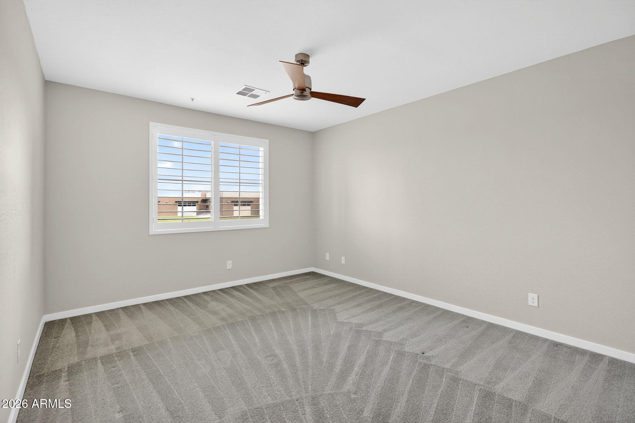 3900 East Baseline Road, Unit 149 Phoenix, AZ 85042 - Photo 17 of 54 an empty room with windows and fan