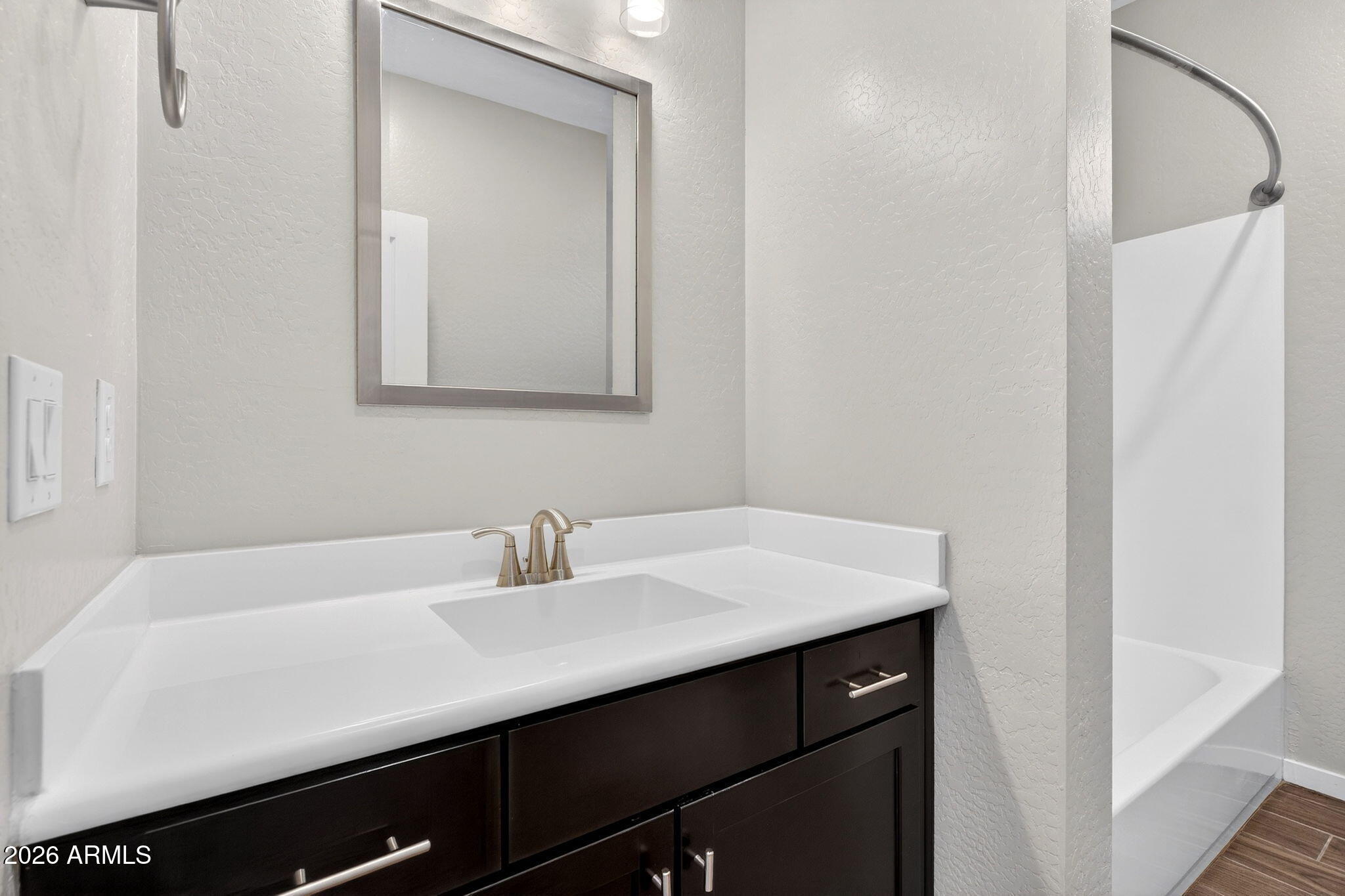 3900 East Baseline Road, Unit 149 Phoenix, AZ 85042 - Photo 26 of 54 a bathroom with a sink and a mirror