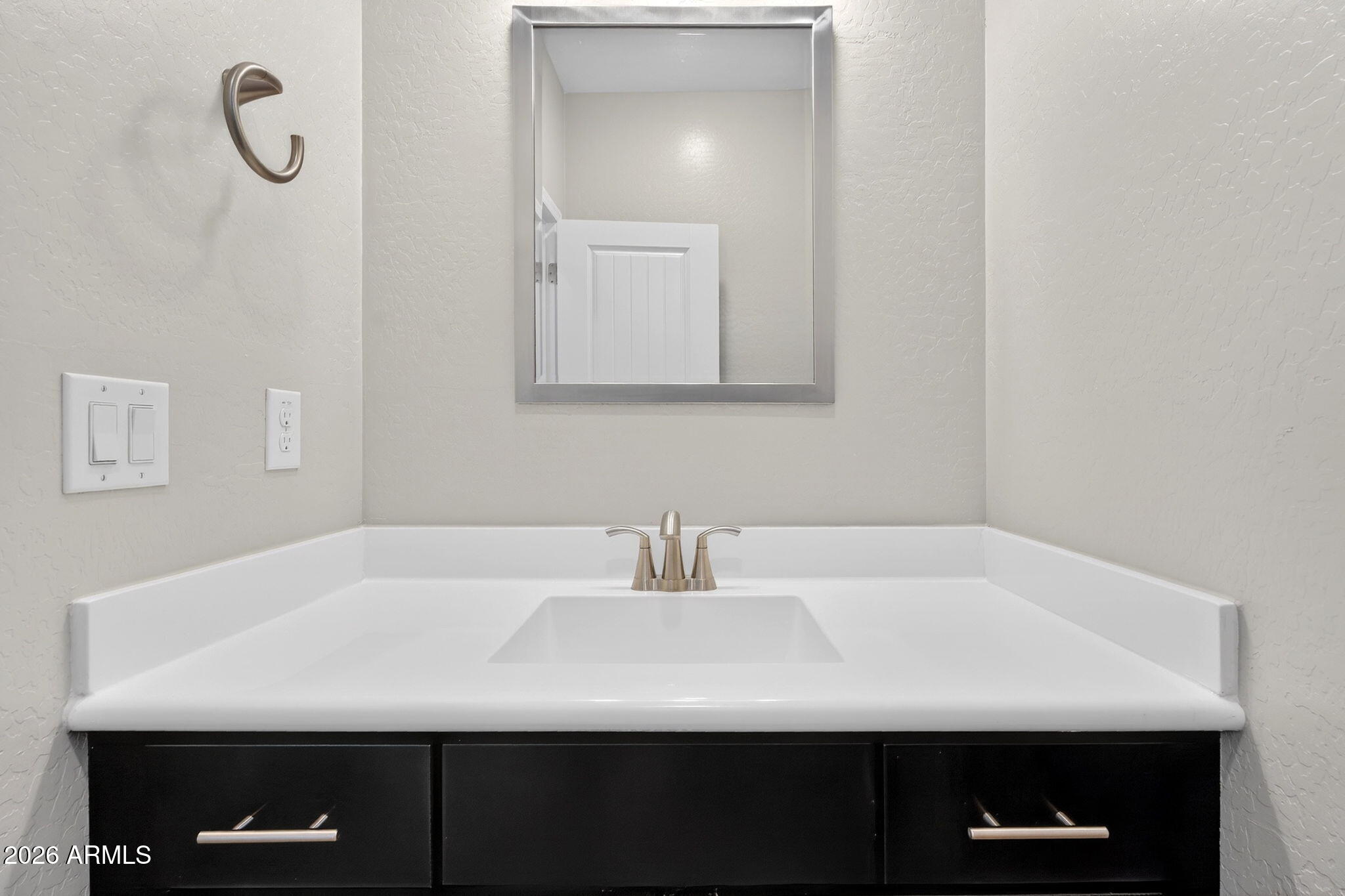 3900 East Baseline Road, Unit 149 Phoenix, AZ 85042 - Photo 27 of 54 a bathroom with a sink and a mirror