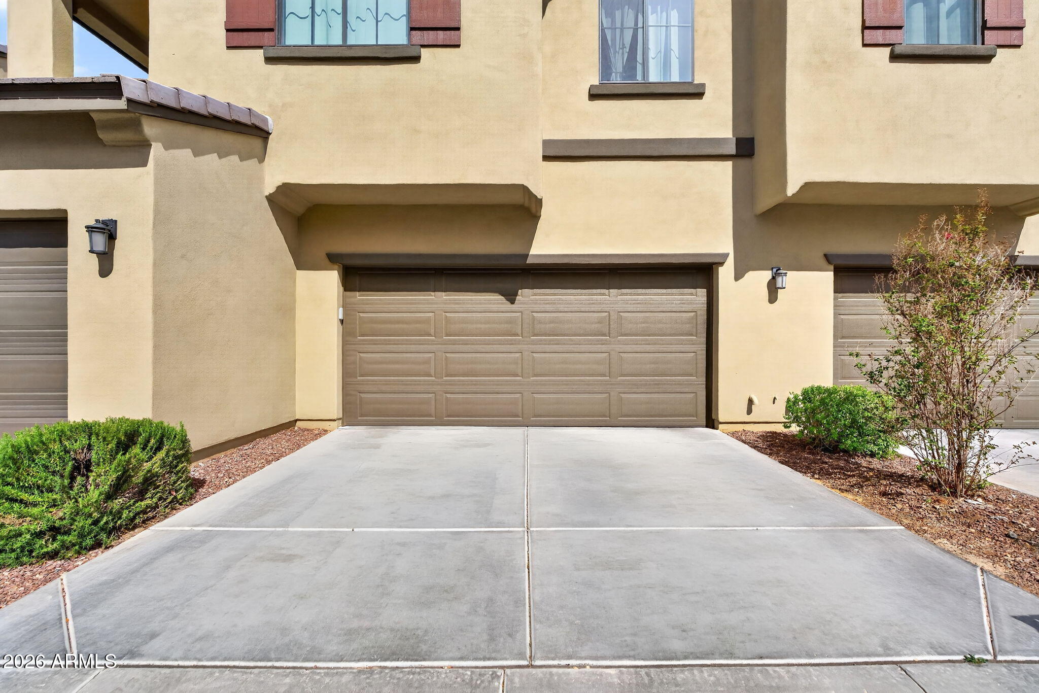3900 East Baseline Road, Unit 149 Phoenix, AZ 85042 - Photo 34 of 54 a front view of a house with a yard and garage