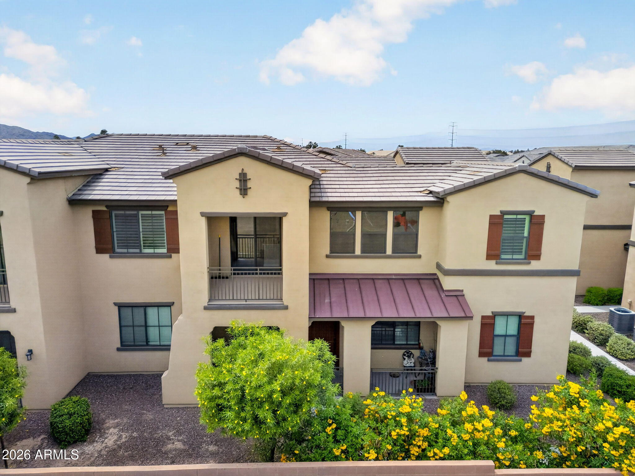 3900 East Baseline Road, Unit 149 Phoenix, AZ 85042 - Photo 42 of 54 a front view of a house with garden