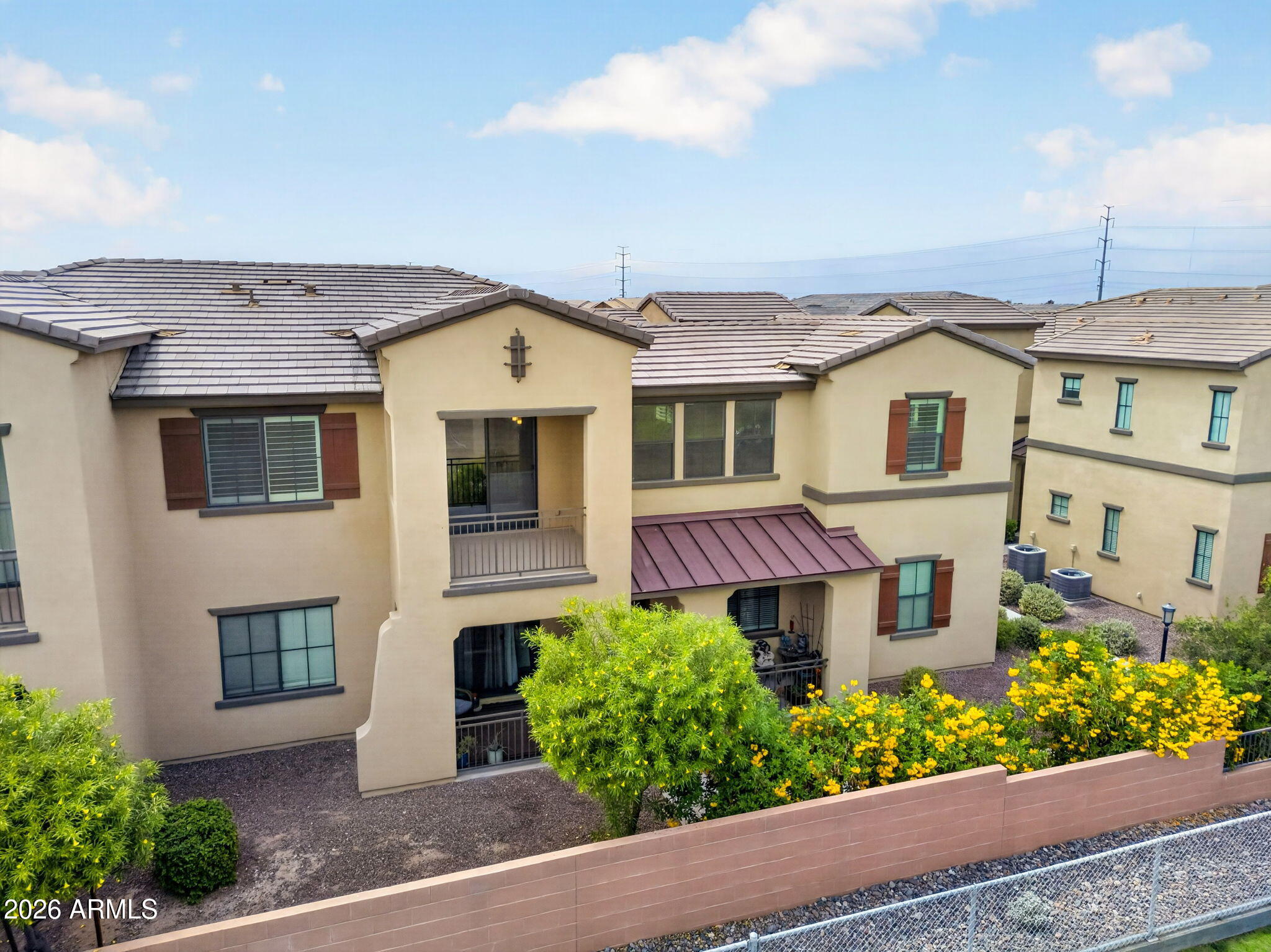 3900 East Baseline Road, Unit 149 Phoenix, AZ 85042 - Photo 43 of 54 a front view of a house with a yard