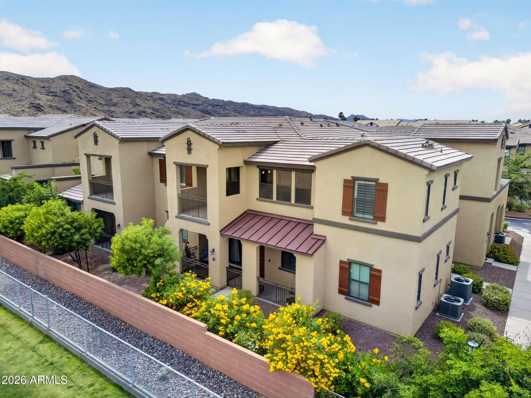 3900 East Baseline Road, Unit 149 Phoenix, AZ 85042 - Photo 44 of 54 a aerial view of a house with a yard and potted plants