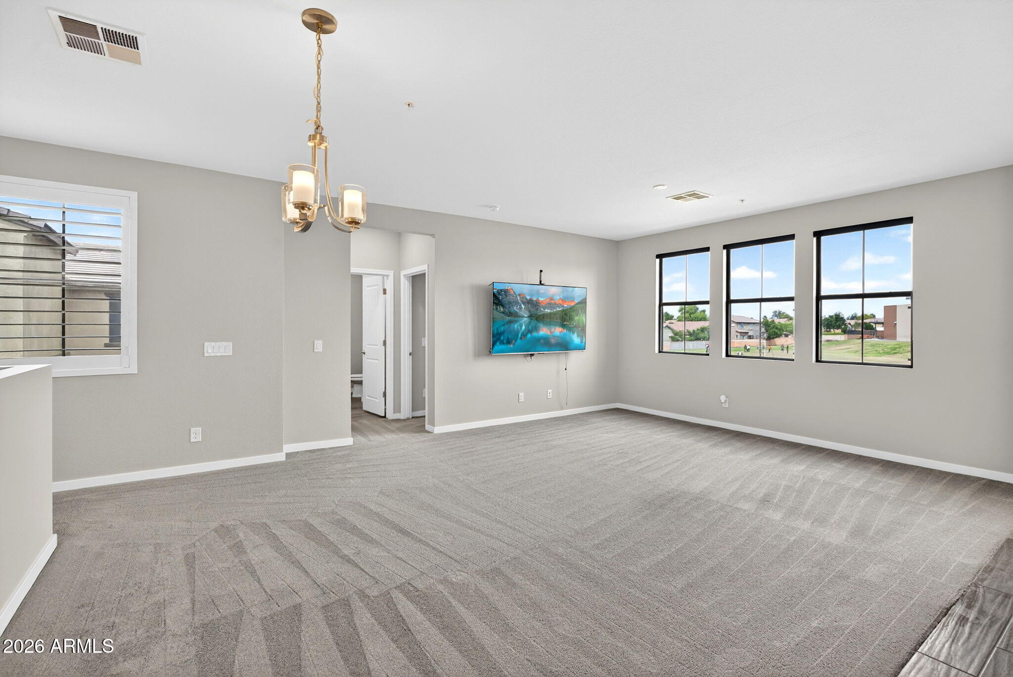 3900 East Baseline Road, Unit 149 Phoenix, AZ 85042 - Photo 4 of 54 a view of an empty room with window