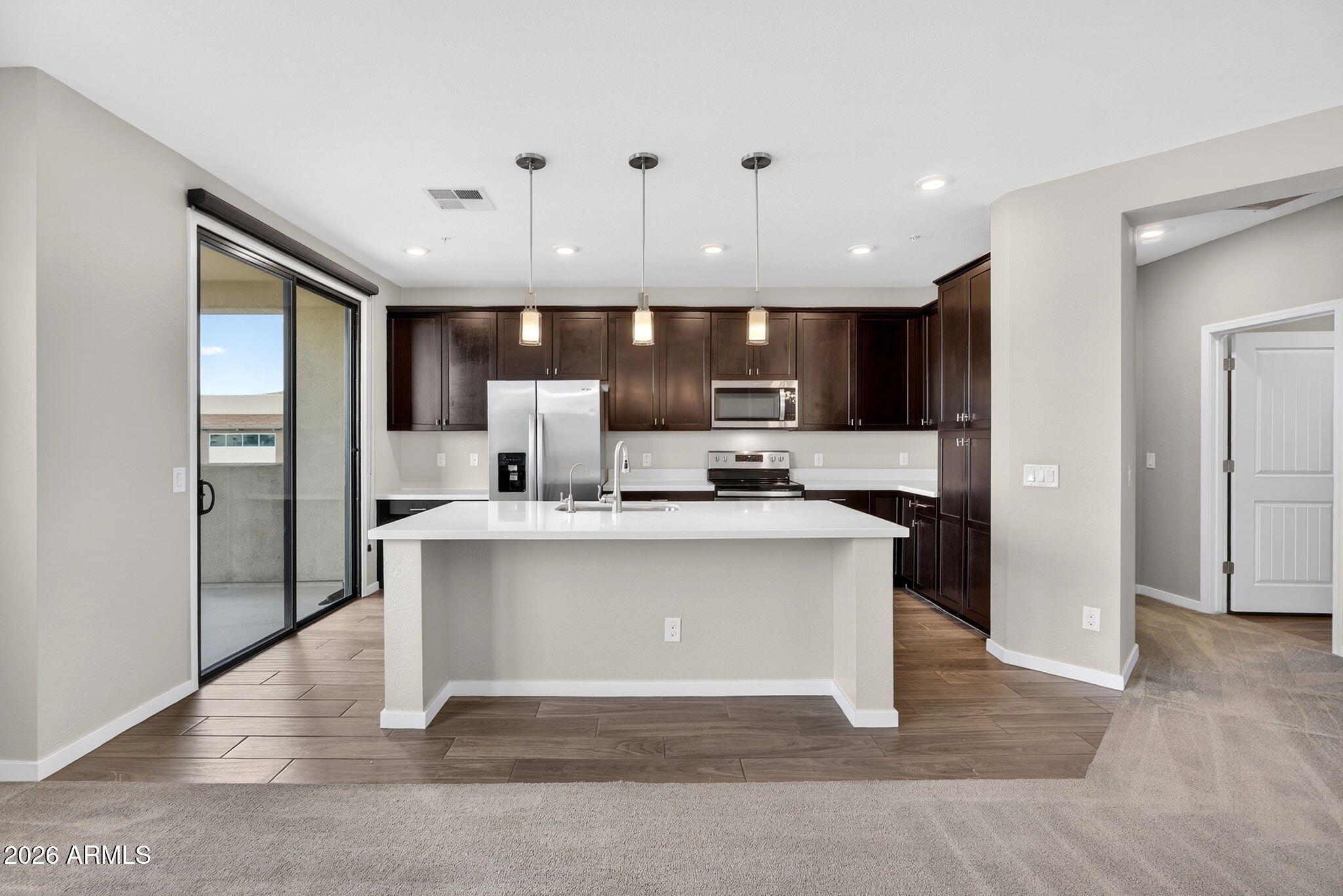 3900 East Baseline Road, Unit 149 Phoenix, AZ 85042 - Photo 7 of 54 a view of kitchen with stainless steel appliances granite countertop refrigerator stove microwave and cabinets