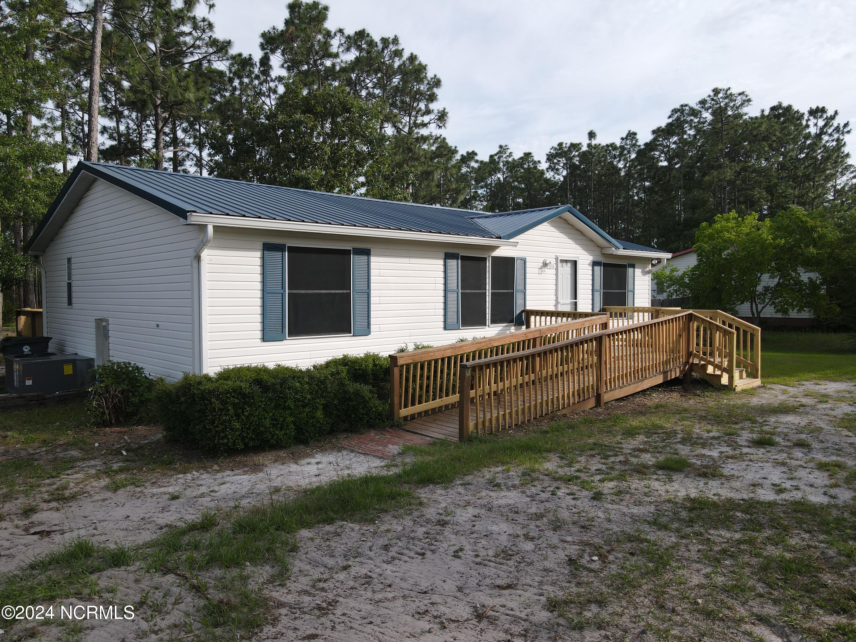 7331 Hunters Ridge Drive Leland, NC 28451 - Photo 2 of 31 dji_fly_20240602_181254_542_171736639265