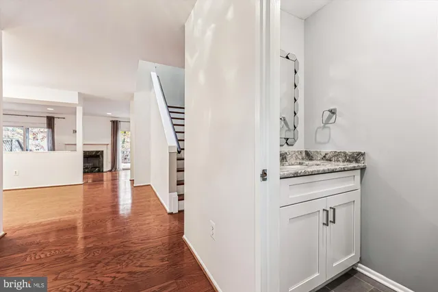 a view of cabinets with wooden floor and electronic appliances