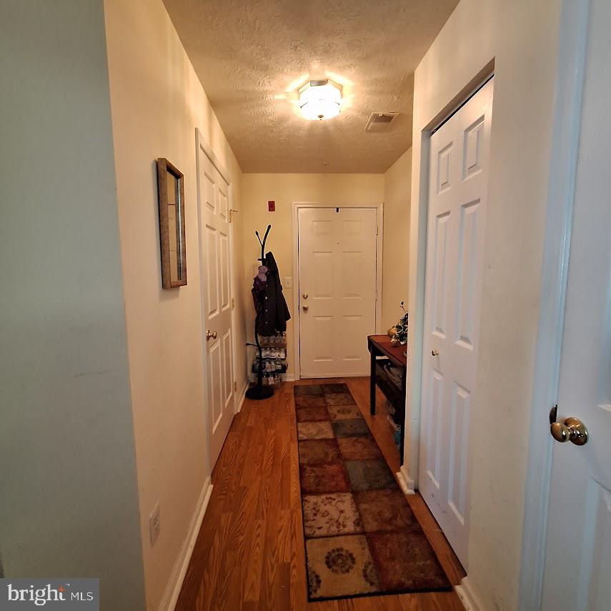 9609 Haven Farm Road, Unit 9609H Perry Hall, MD 21128 - Photo 4 of 21 Welcoming hallway with warm tones.