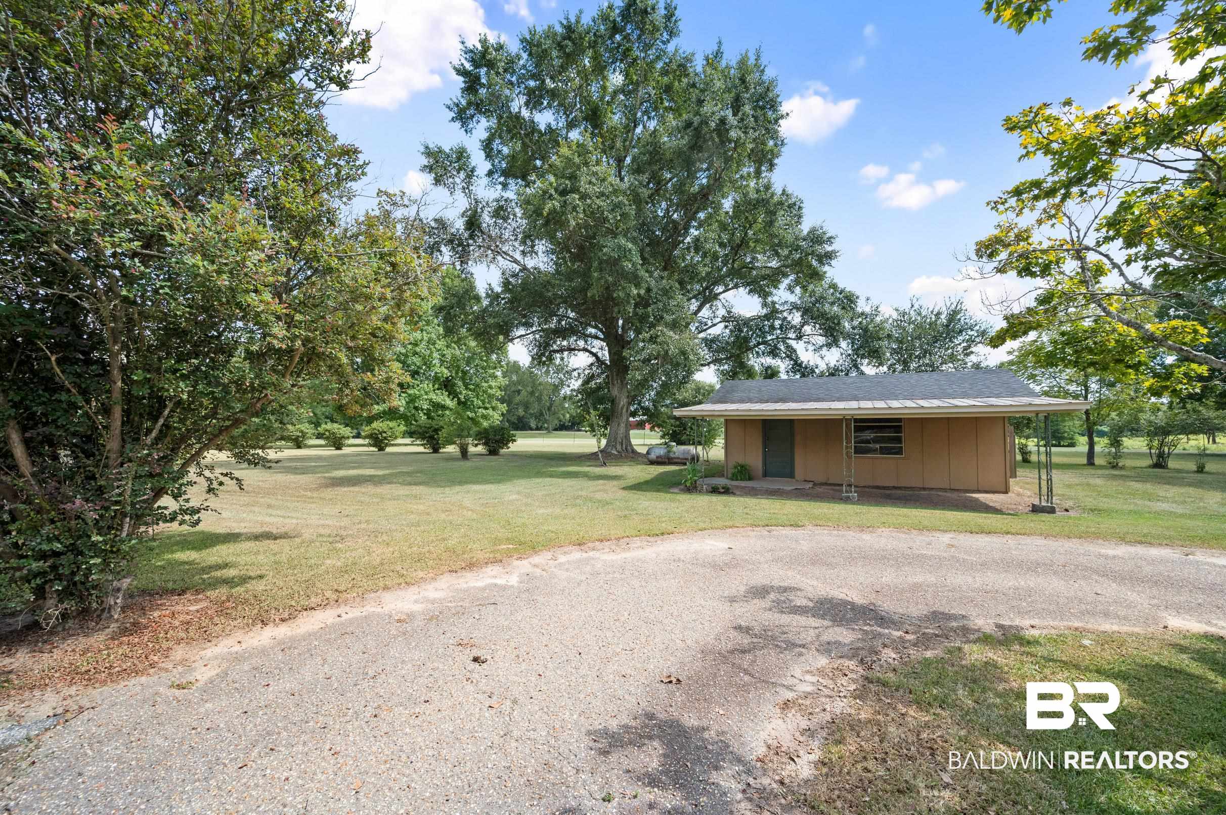15600 Fackler Road Loxley, AL 36551 - Photo 41 of 51 Exterior space with a front lawn
