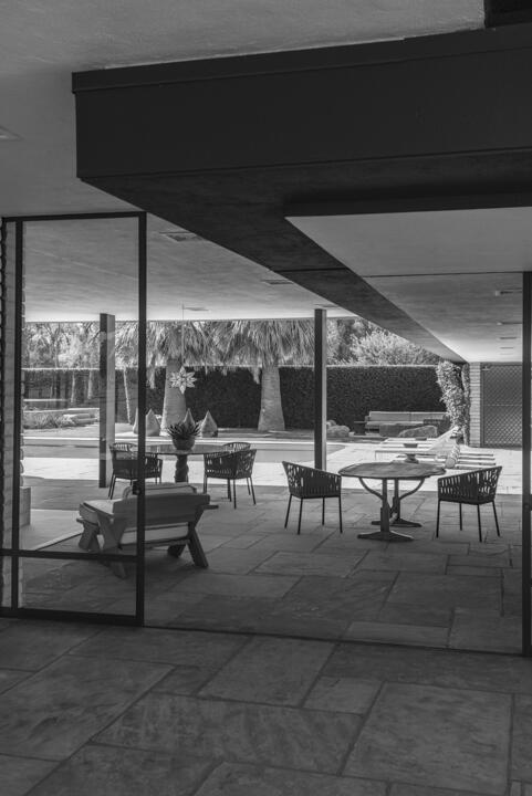 40555 Sand Dune Road Rancho Mirage, CA 92270 - Photo 7 of 10 a living room with couches and a dining table with a potted plant