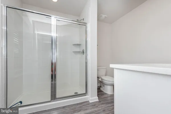 a bathroom with a sink vanity and a mirror
