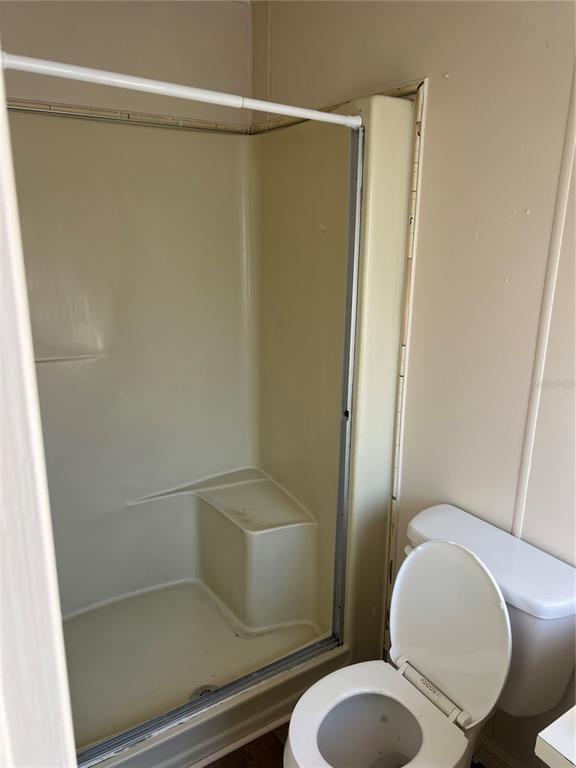 1610 Reynolds Road, Unit 87 Lakeland, FL 33801 - Photo 11 of 12 a white toilet sitting next to a bathroom sink