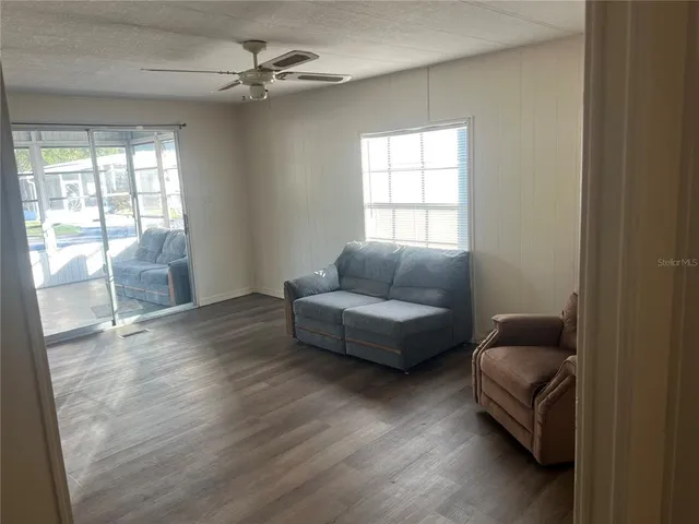 a living room with furniture and a window