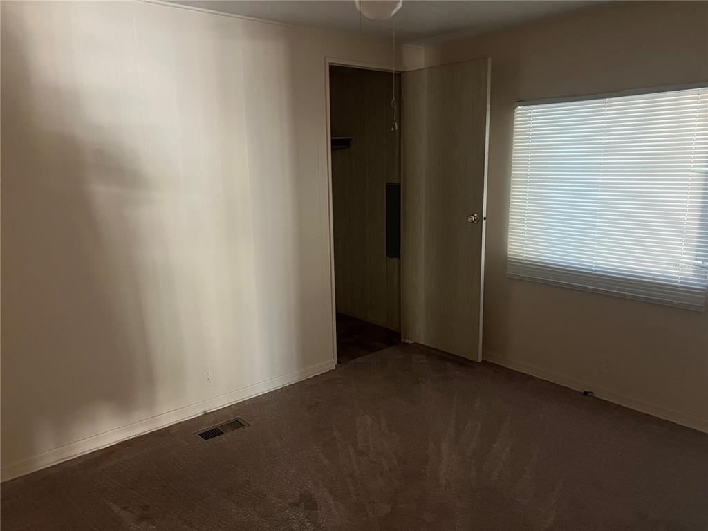 1610 Reynolds Road, Unit 87 Lakeland, FL 33801 - Photo 9 of 12 an empty room with windows