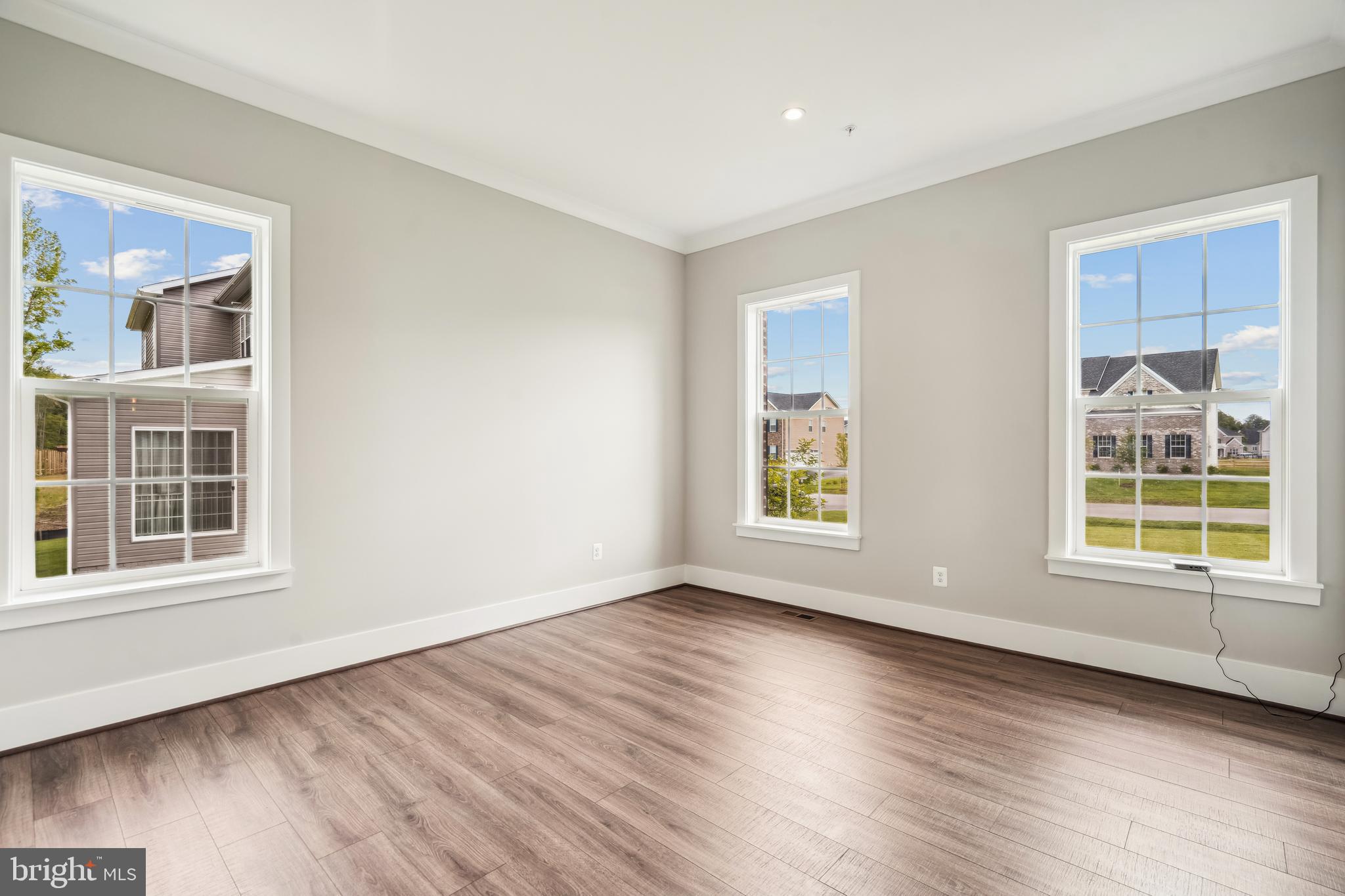 3906 Diplomat Avenue Bowie, MD 20721 - Photo 4 of 47 a view of an empty room with wooden floor and a window