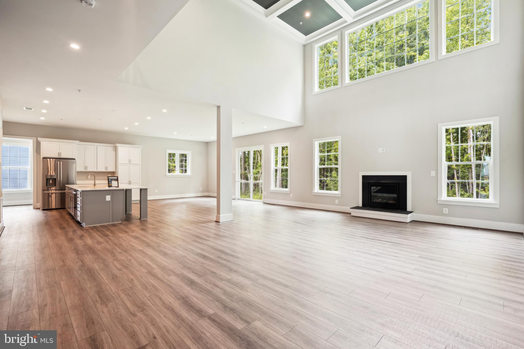 3906 Diplomat Avenue Bowie, MD 20721 - Photo 9 of 47 an empty room with wooden floor and windows