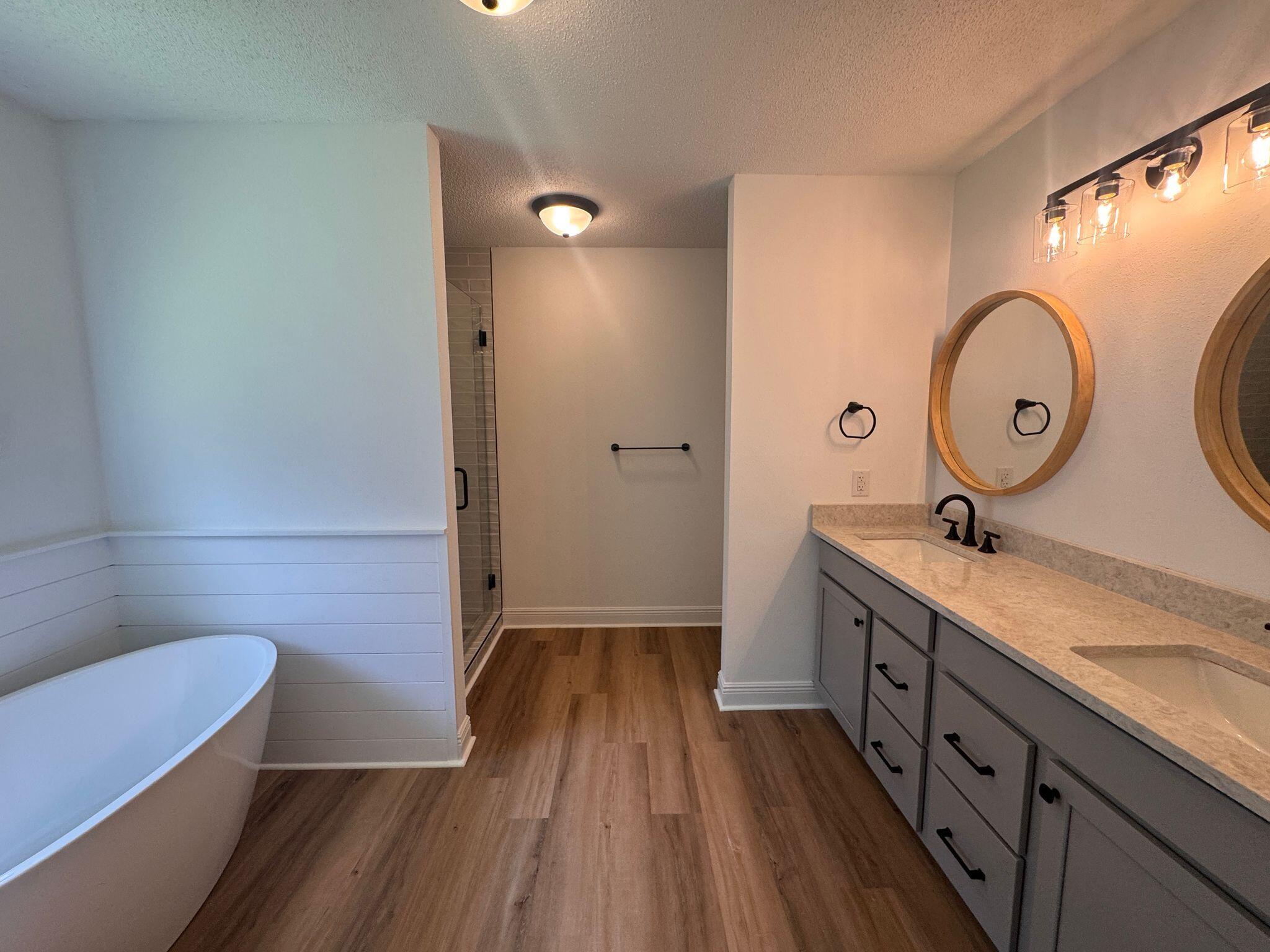 516 Vulpes Sanctuary Loop Crestview, FL 32536 - Photo 12 of 30 a bathroom with a sink and a mirror