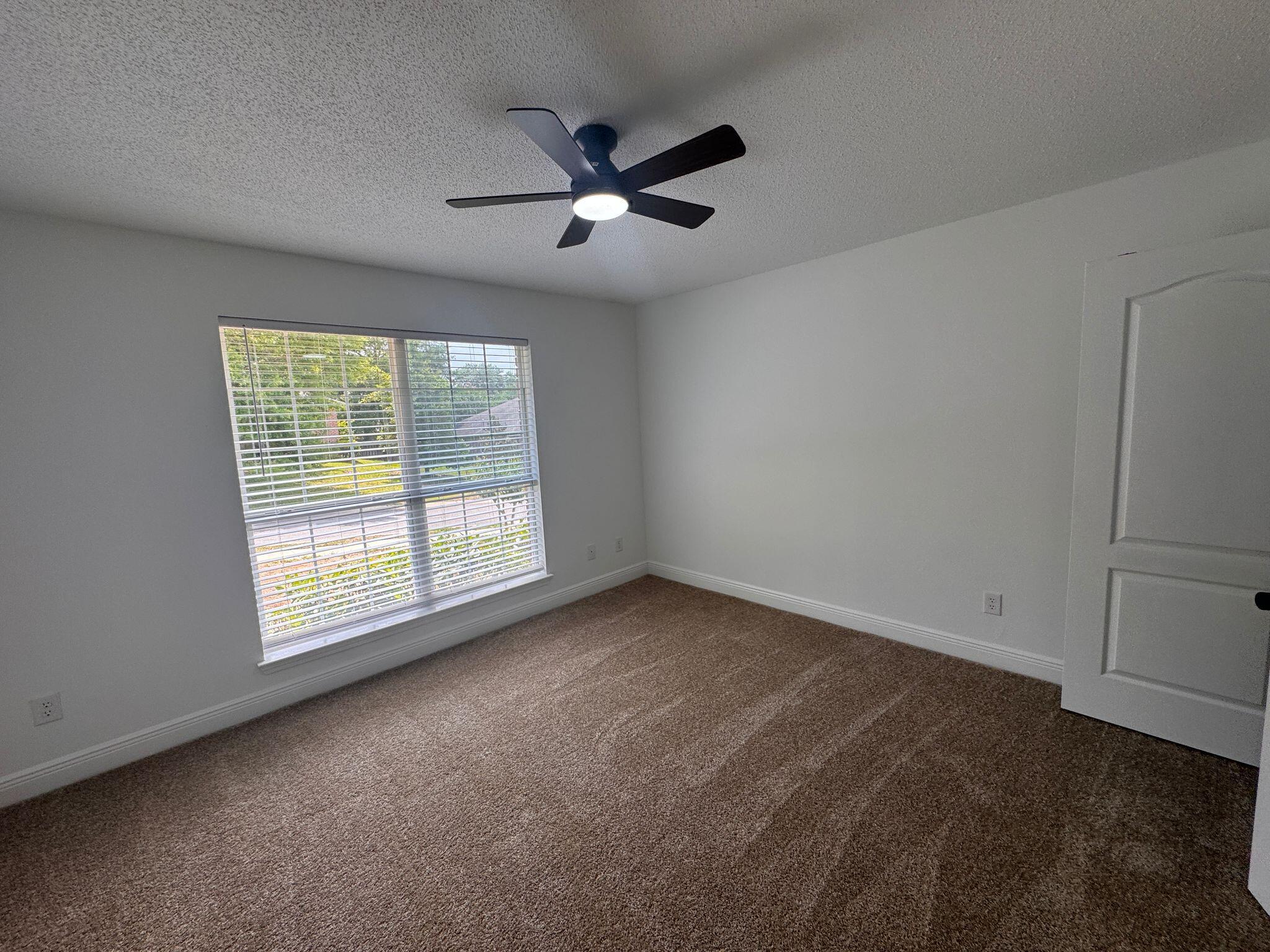 516 Vulpes Sanctuary Loop Crestview, FL 32536 - Photo 19 of 30 a view of an empty room with a window