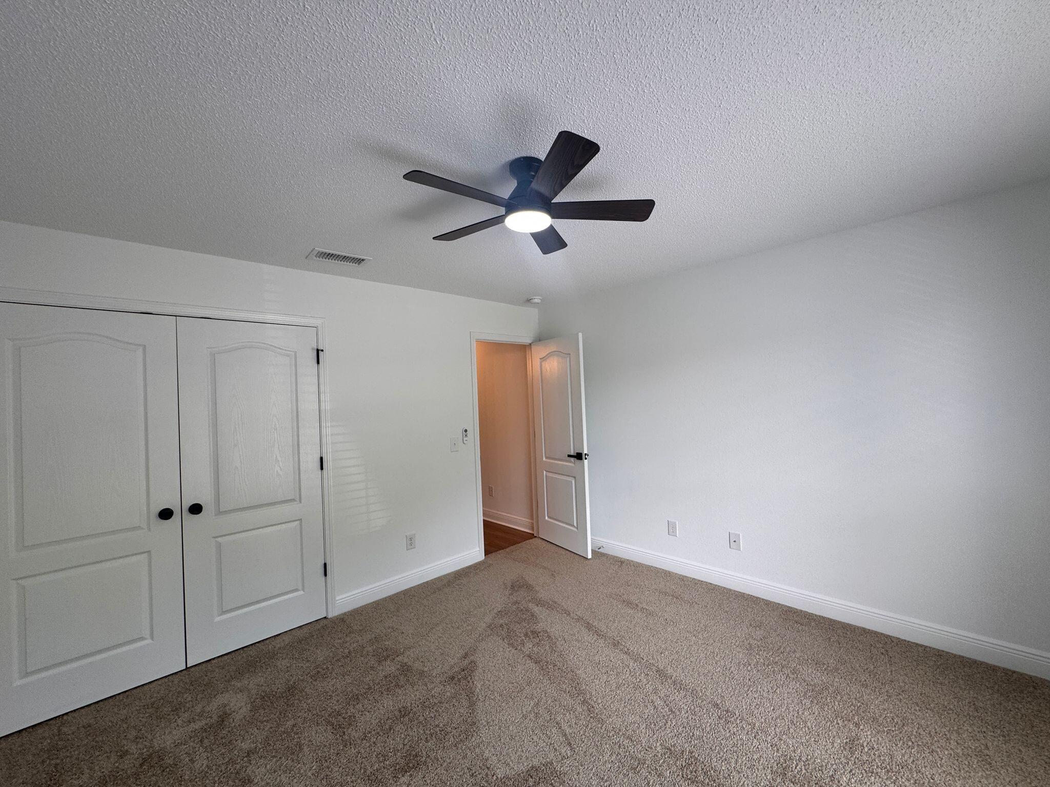 516 Vulpes Sanctuary Loop Crestview, FL 32536 - Photo 20 of 30 a view of a livingroom with a ceiling fan